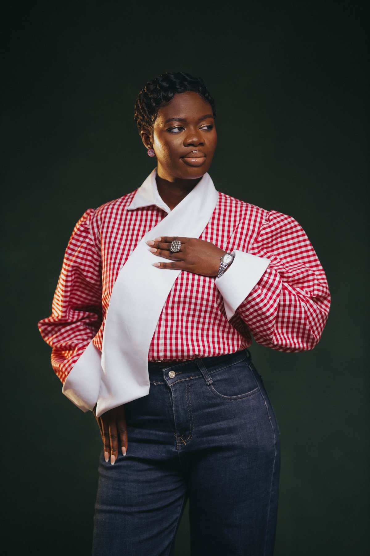 Mansa in a red gingham shirt